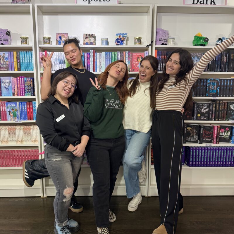 group photo of 5 women inside a bookshop